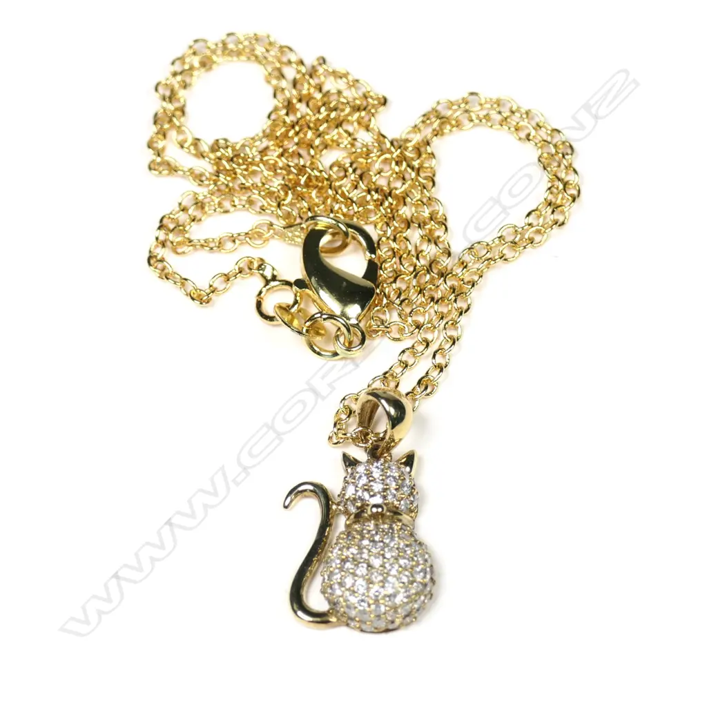 A 9ct yellow gold and diamond cat pendant Image 1++