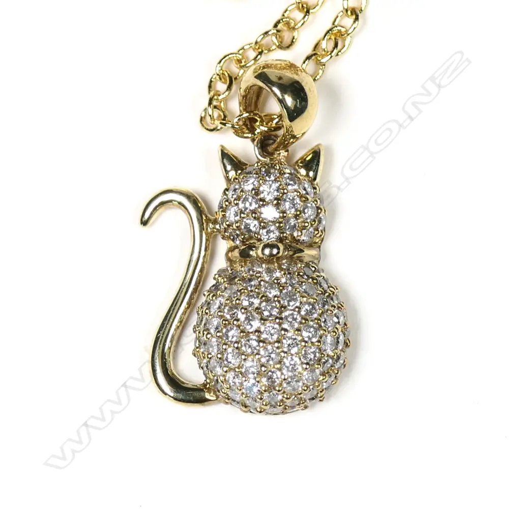 A 9ct yellow gold and diamond cat pendant Image 1++