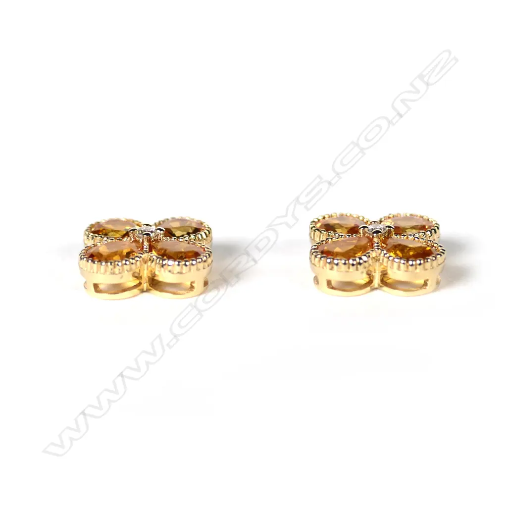 A pair of 14ct gold Ceylonese sapphire and diamond stud earrings Image 1++