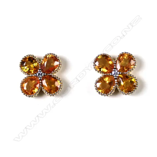 A pair of 14ct gold Ceylonese sapphire and diamond stud earrings