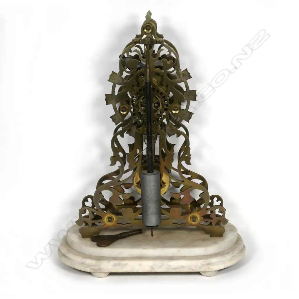 An old brass skeleton clock Image 1++