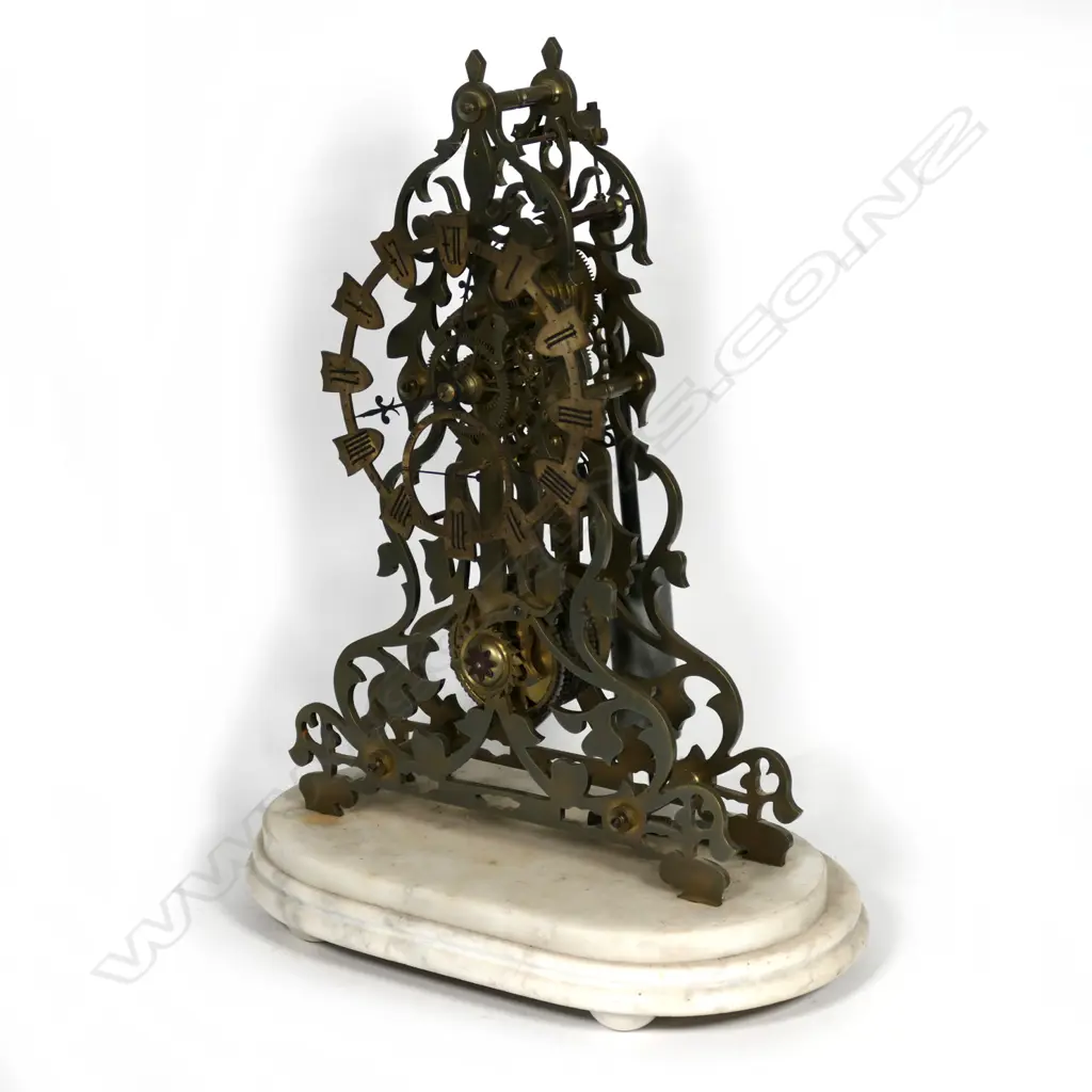 An old brass skeleton clock Image 1++