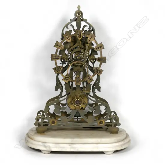 An old brass skeleton clock