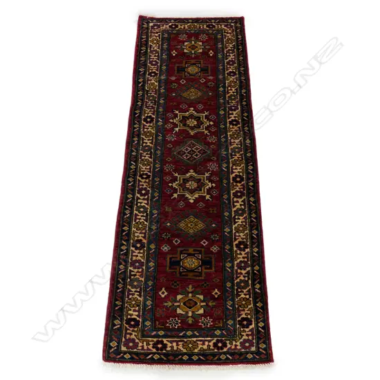 A hand knotted Kazak small runner