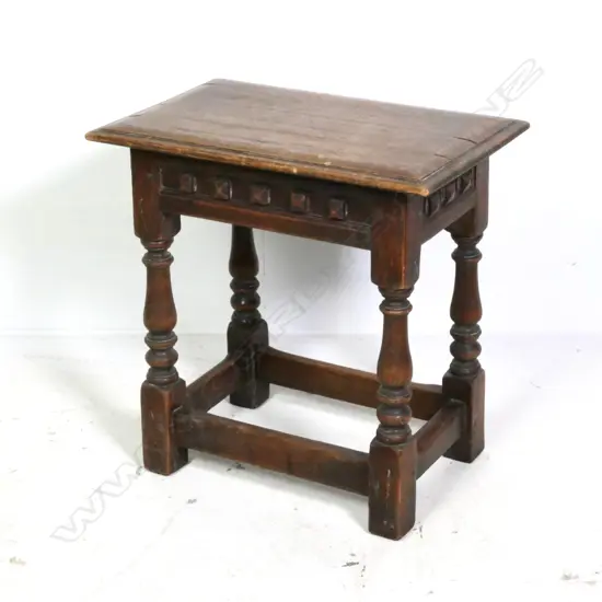 A vintage oak Elizabethan style stool