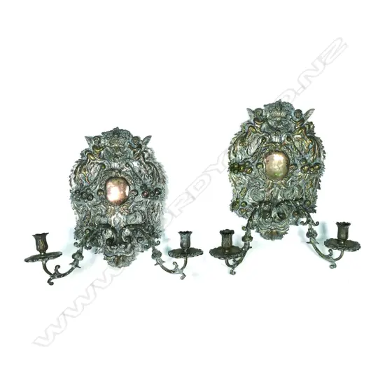 A pair of 19thC highly decorative candle sconces