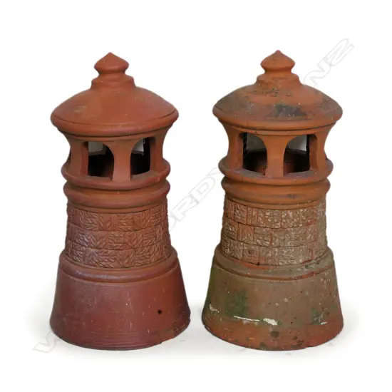 A rare pair of Peter Hutson (Wellington) terracotta chimney pots