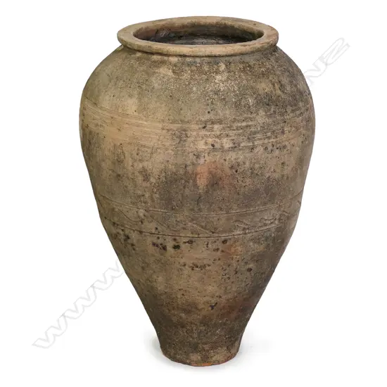 An old European terracotta tall olive oil storage jar