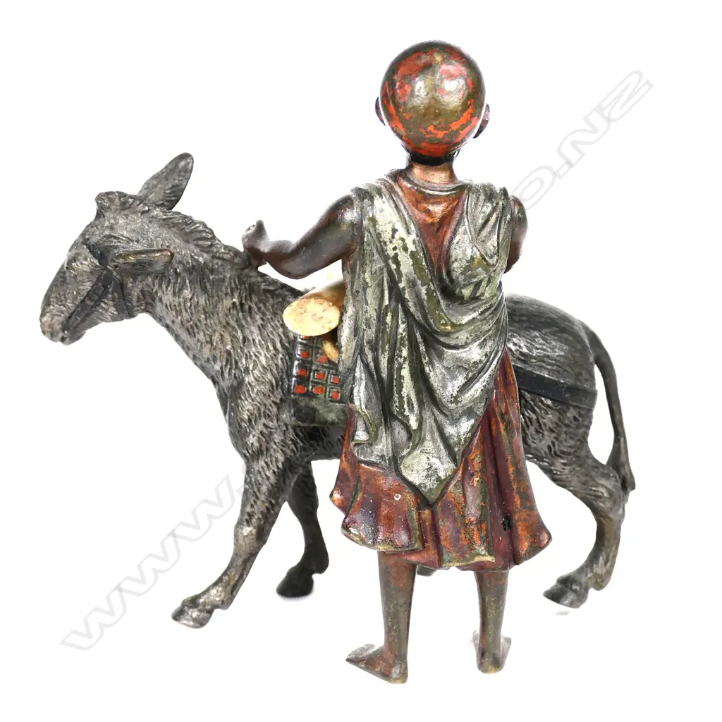 A small cold painted bronze figure of an Arab boy Image 1++