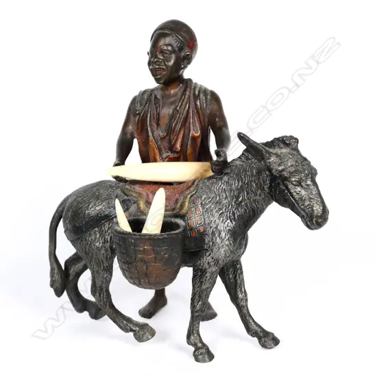 A small cold painted bronze figure of an Arab boy