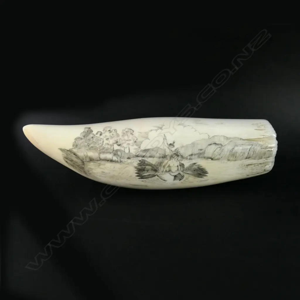 A 20thC finely scrimshawed ivory whales’ tooth 'Maori War Canoes at Sea 1827' Image 1++