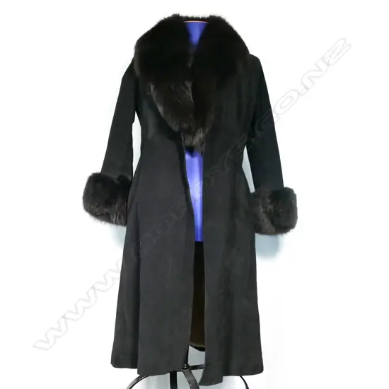 A full-length black suede coat with black fox collar and cuffs