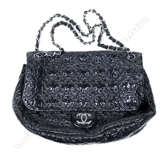 A Chanel black patent handbag