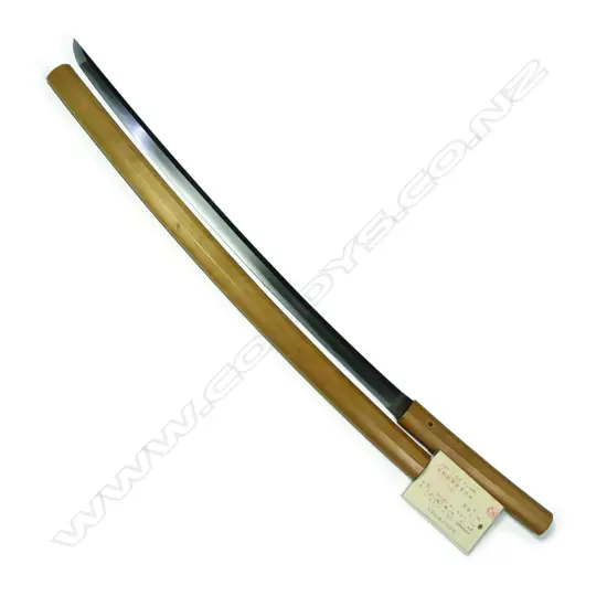 An old Japanese katana sword blade in shirasaya. displaying a fairly straight hamon