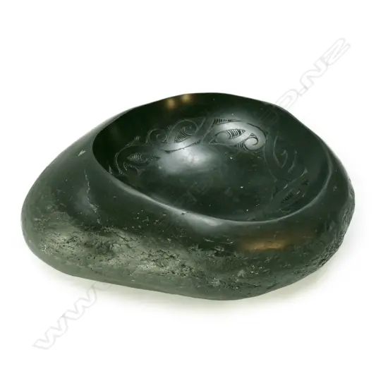 A large pounamu river worn boulder bowl