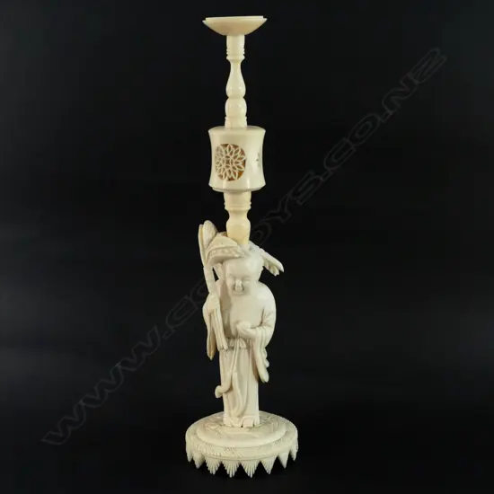 An early 20thC Chinese tall carved ivory figured stand puzzle ball