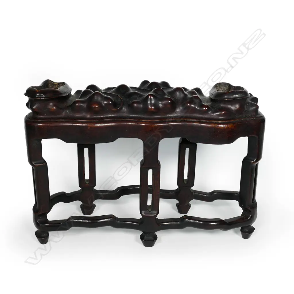 An oriental arched 'lingbi' scholars rock on stand Image 1++