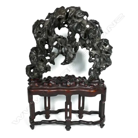 An oriental arched 'lingbi' scholars rock on stand