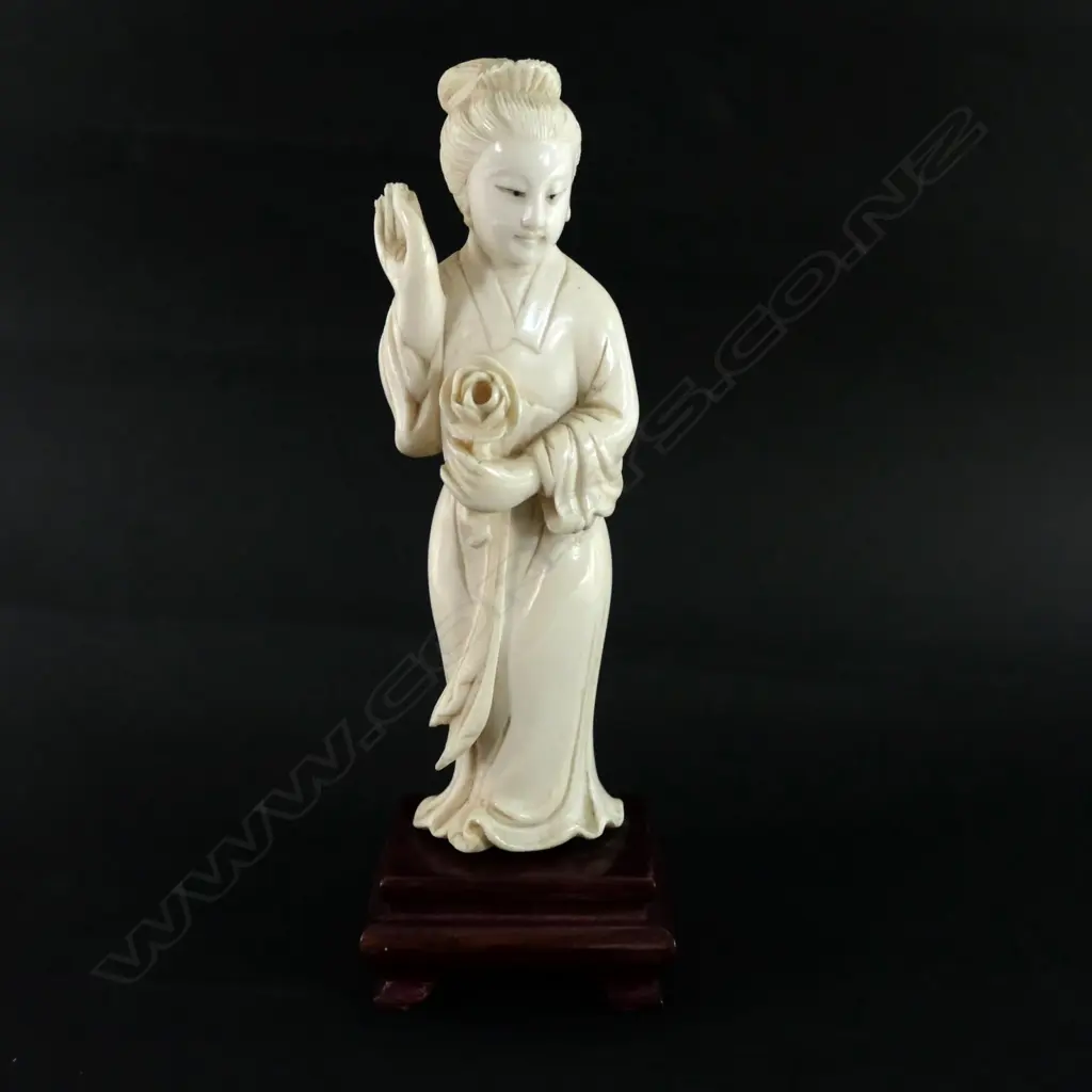 An oriental carved ivory standing woman carving Image 1++