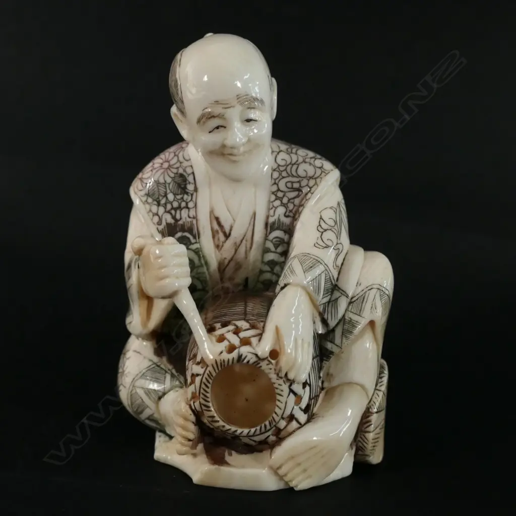 A Japanese ivory carving of a basket maker Image 1++