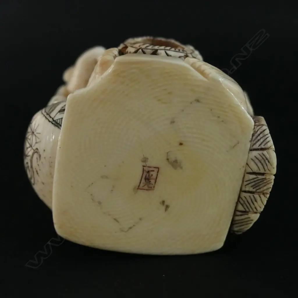 A Japanese ivory carving of a basket maker Image 1++