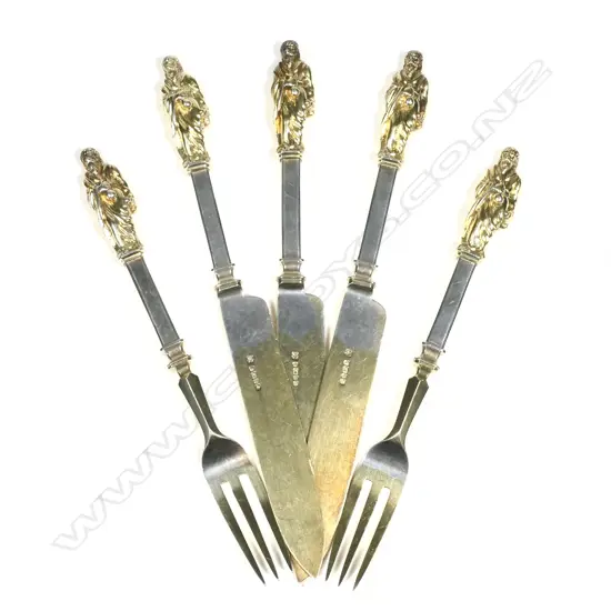 Three knives and two forks with ornate figured finials