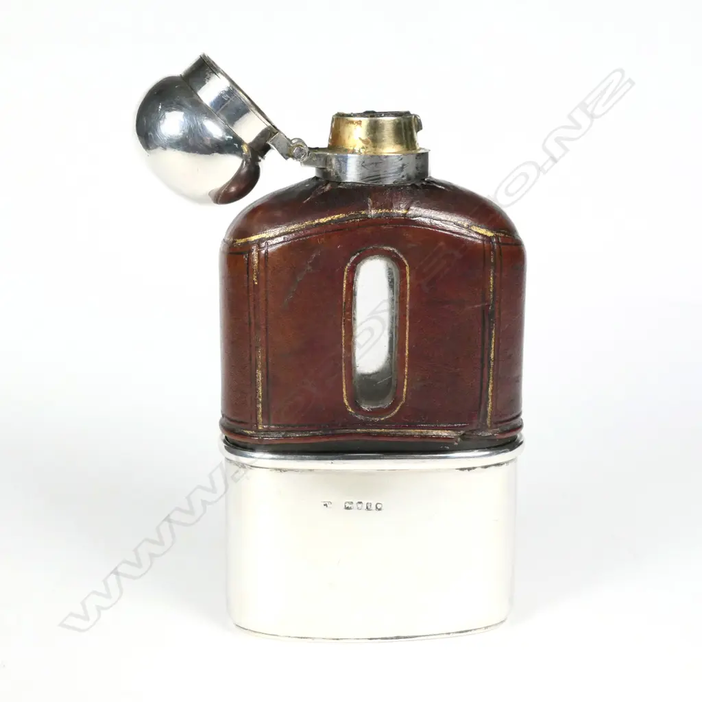 A hip flask with silver removeable cup Image 1++