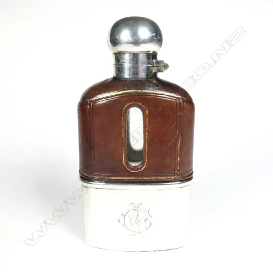 A hip flask with silver removeable cup