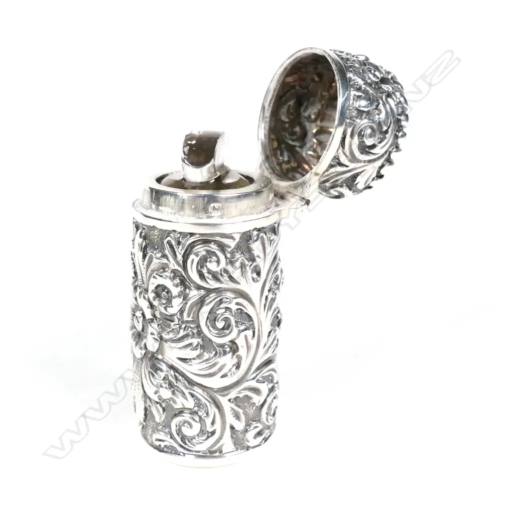 A Victorian silver cased perfume bottle Image 1++