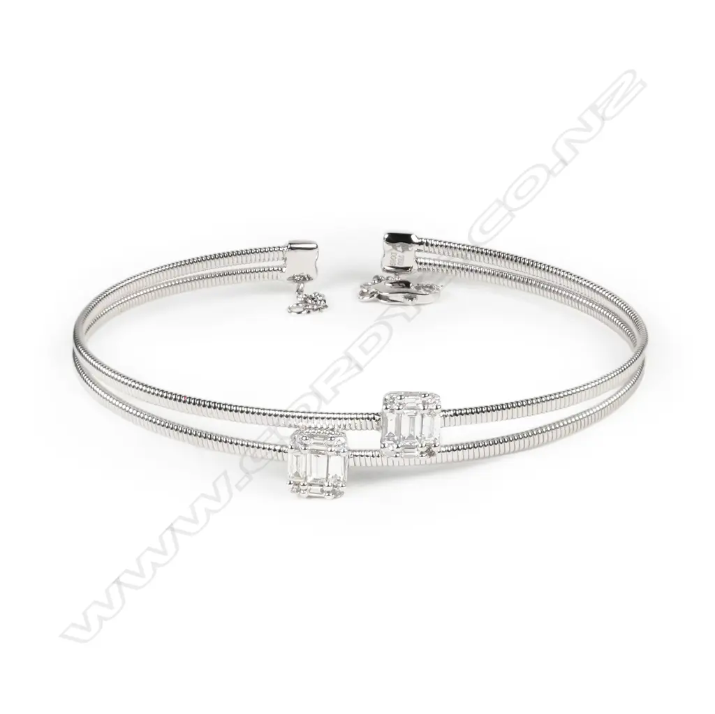An 18ct white gold and diamond sprung bangle Image 1++