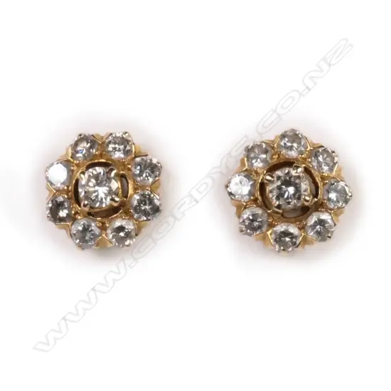 A pair of 14ct gold and diamond cluster earrings