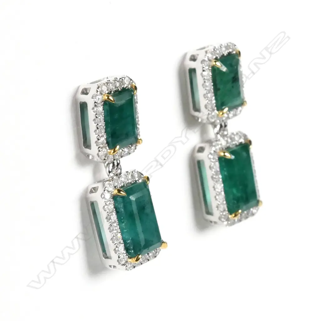 A pair of 14ct white gold emerald and diamond drop earrings Image 1++