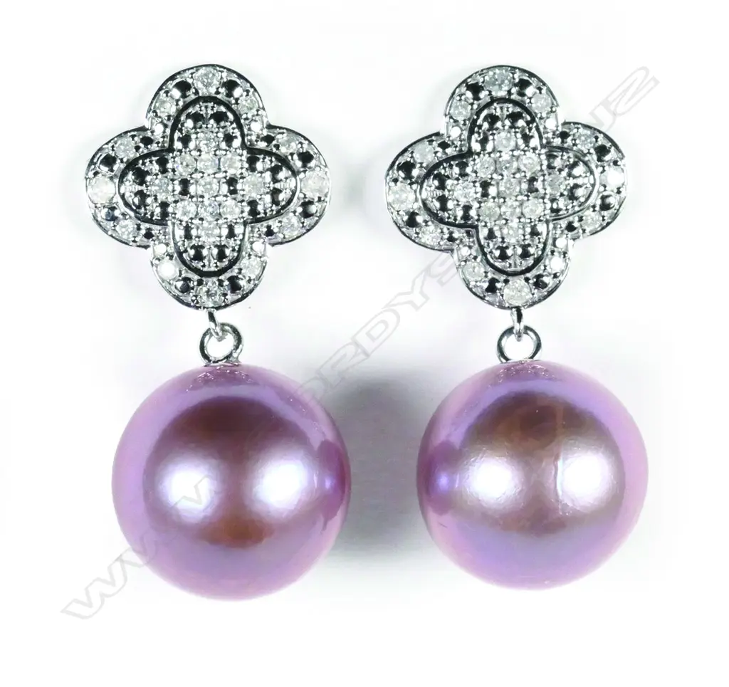 A pair of 14ct white gold pearl and diamond drop earrings Image 1++