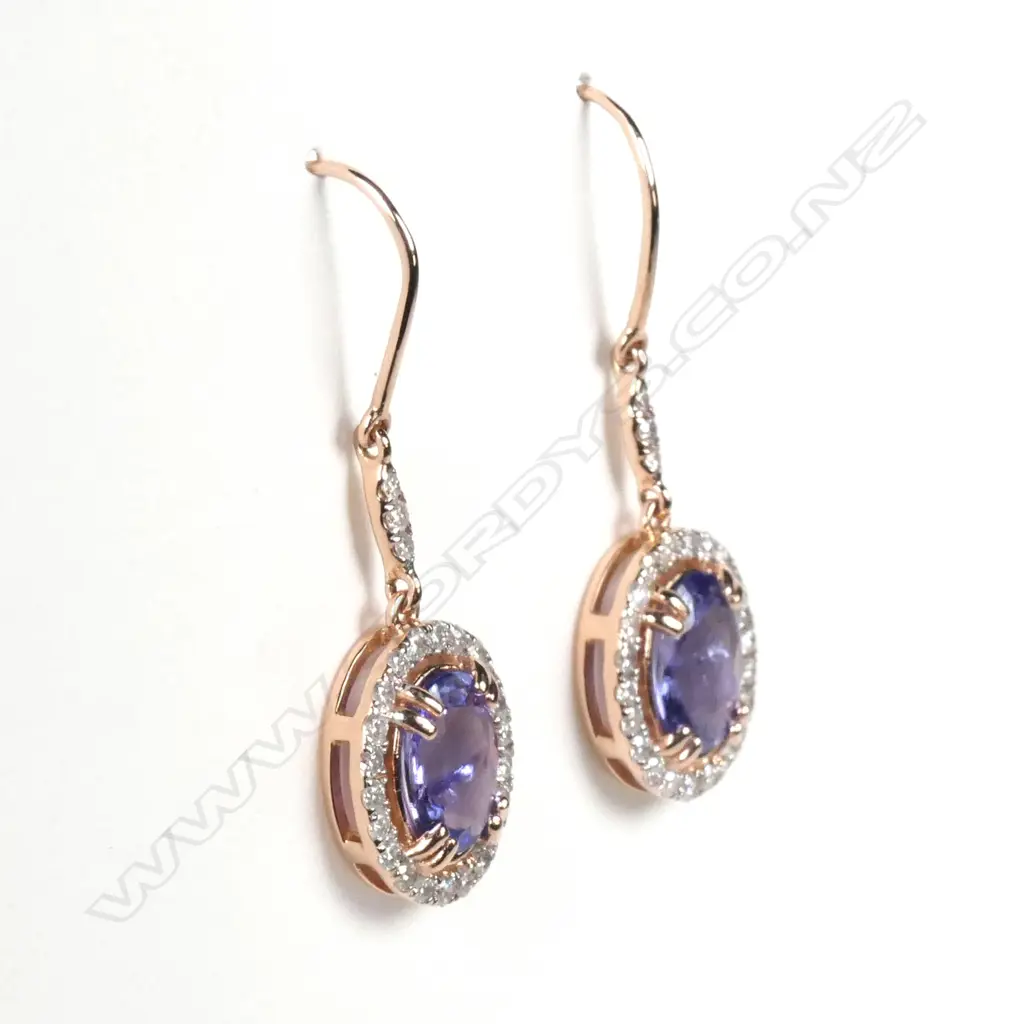 A pair of 14ct rose gold tanzanite and diamond drop earrings Image 1++