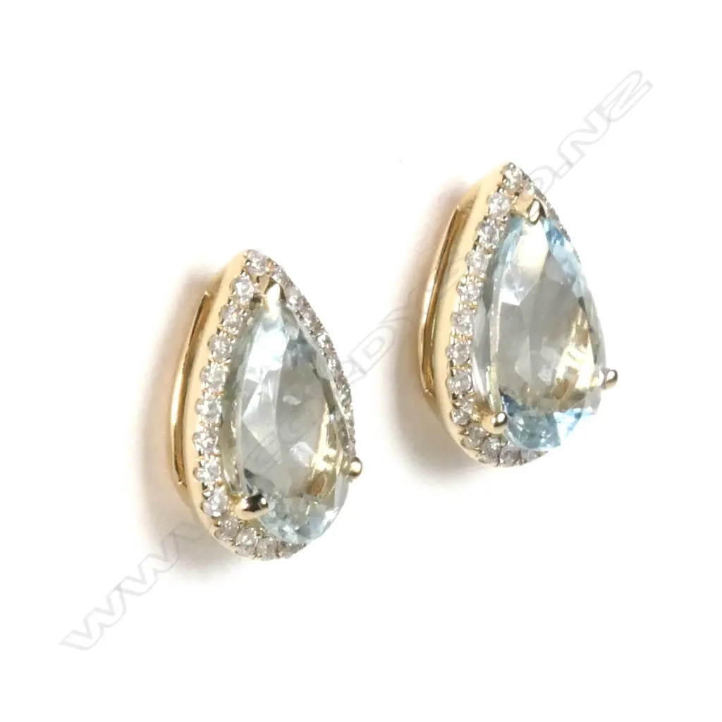 A pair of 14ct yellow gold aquamarine and diamond halo stud earrings Image 1++