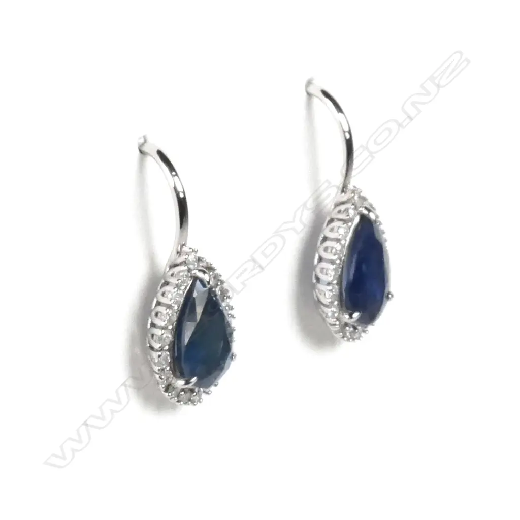 A pair of 14ct white gold sapphire and diamond earrings Image 1++