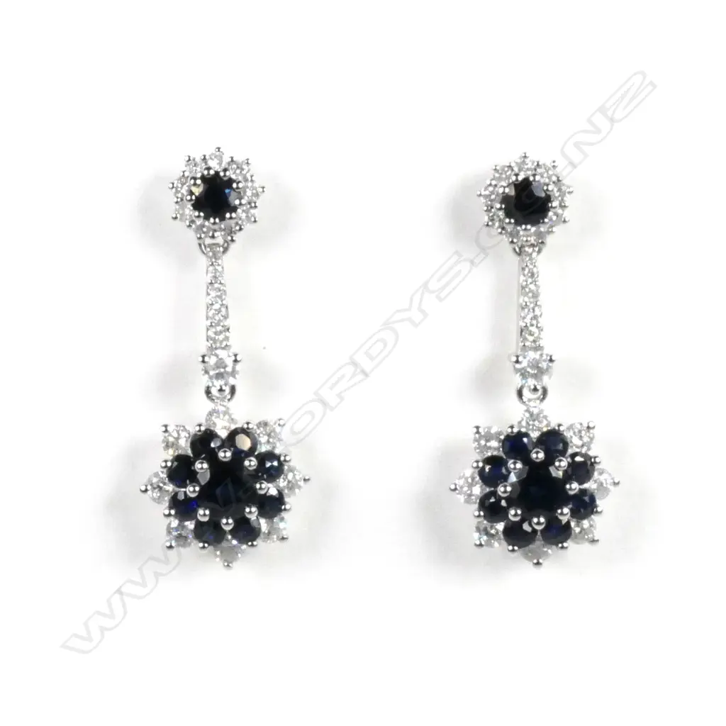 A pair of 14ct white gold sapphire and diamond flower design drop earrings Image 1++