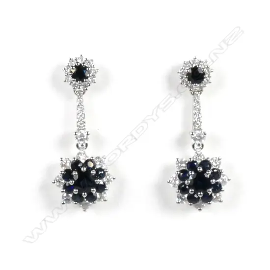 A pair of 14ct white gold sapphire and diamond flower design drop earrings