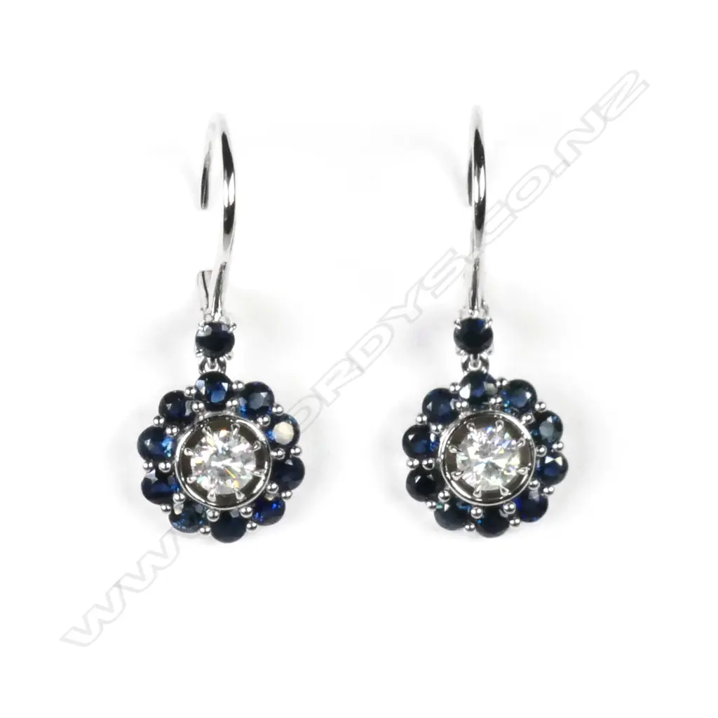 A pair of 14ct white gold sapphire and diamond drop earrings Image 1++