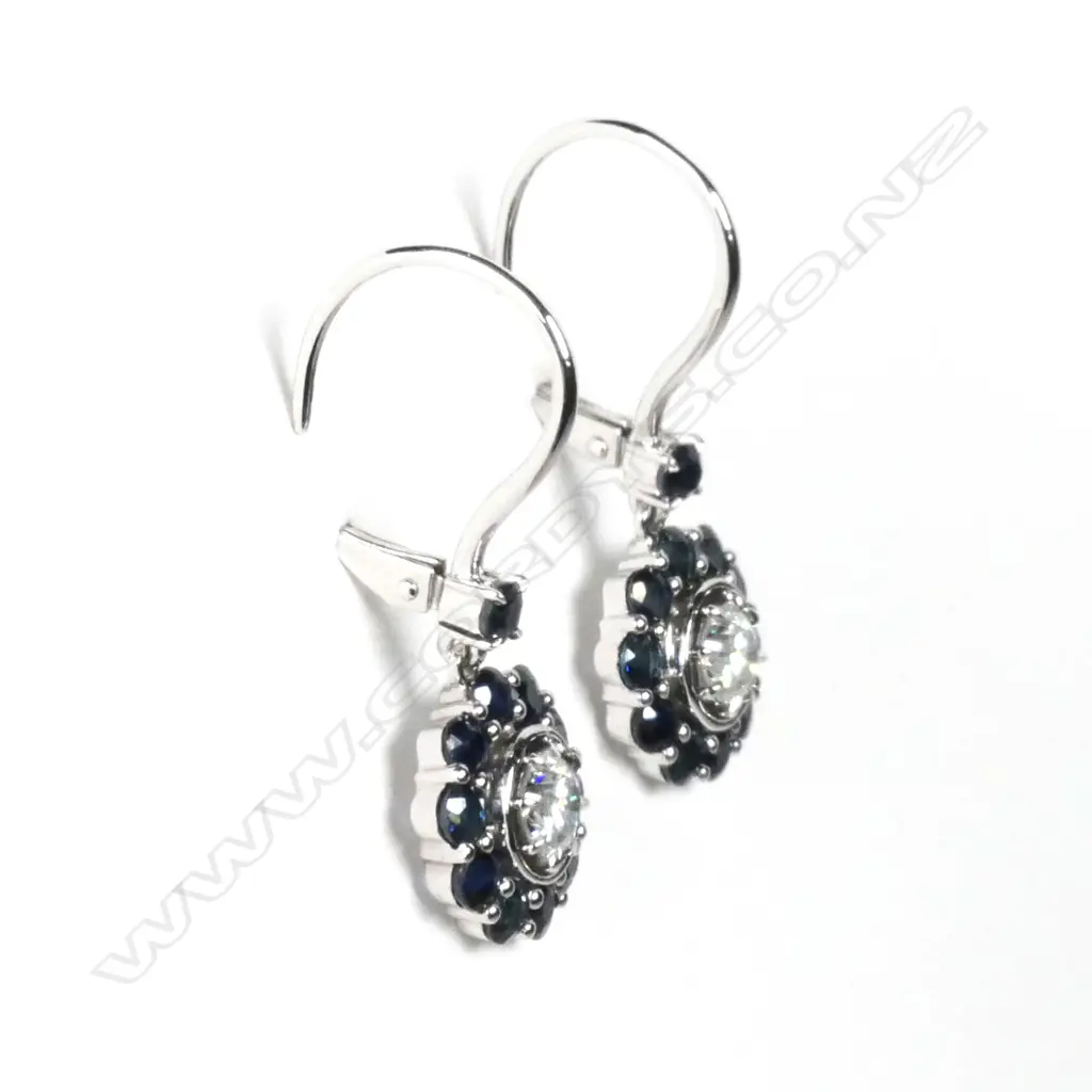A pair of 14ct white gold sapphire and diamond drop earrings Image 1++