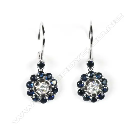 A pair of 14ct white gold sapphire and diamond drop earrings