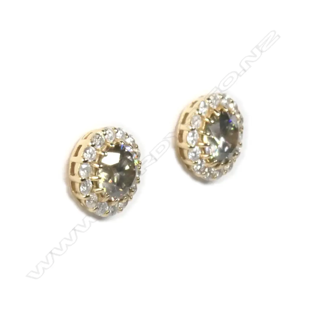 A pair of 14ct gold diamond halo stud earrings Image 1++