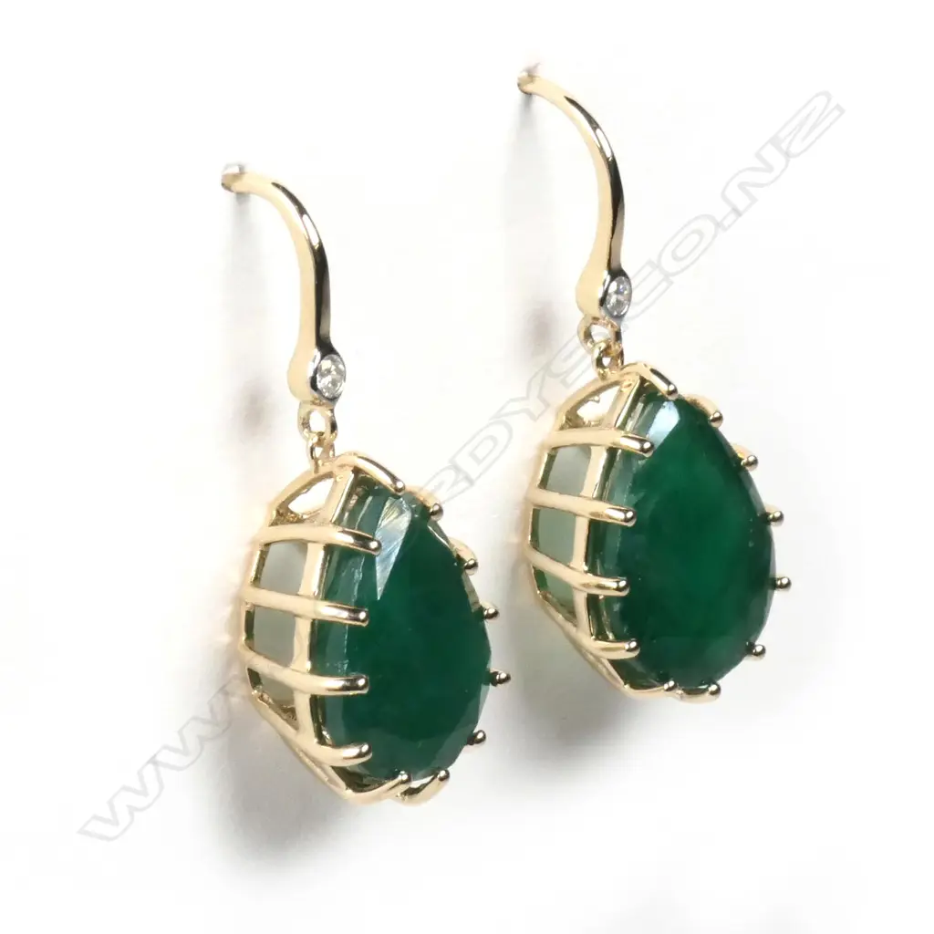 A pair of 14ct gold emerald and diamond earrings Image 1++