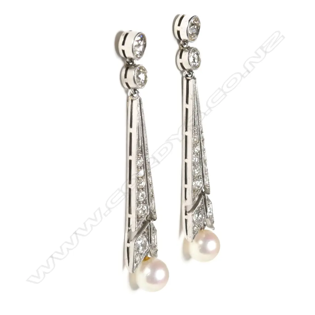 A pair of period platinum Art Deco diamond and pearl earrings Image 1++