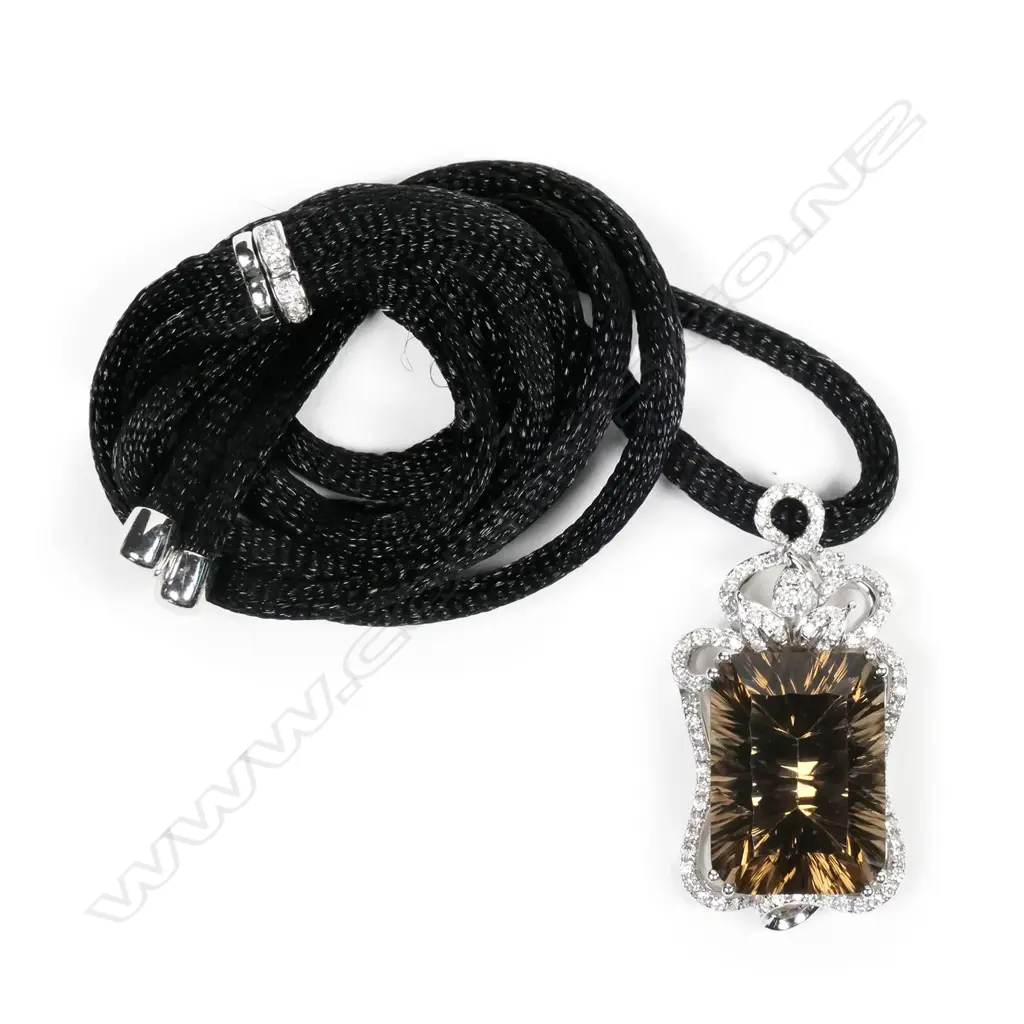 An 18ct white gold framed large smoky quartz and diamond pendant Image 1++