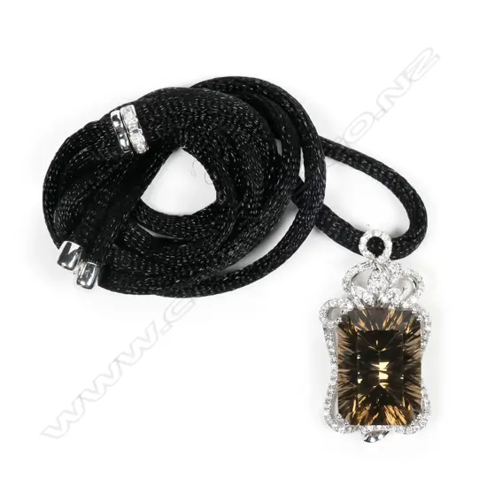 An 18ct white gold framed large smoky quartz and diamond pendant