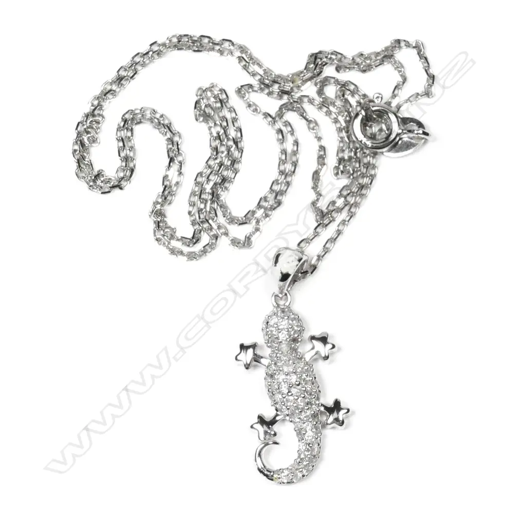 A 9ct white gold and diamond lizard pendant Image 1++