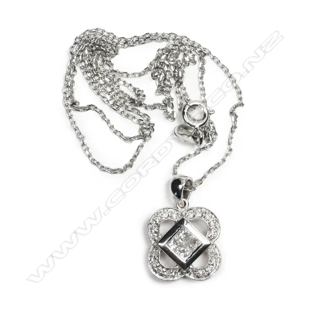 An 18ct white gold and diamond pendant Image 1++