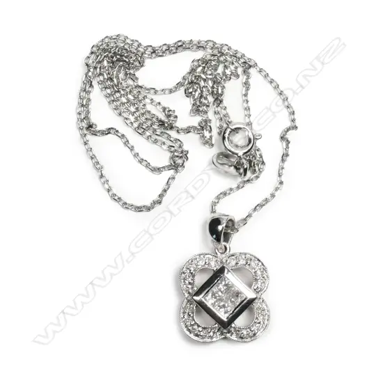 An 18ct white gold and diamond pendant
