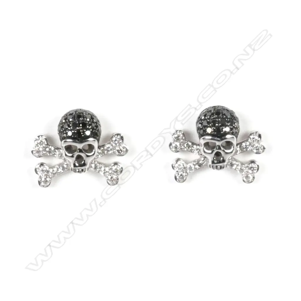 A pair of 18ct white gold and diamond skull and cross-bone earrings Image 1++